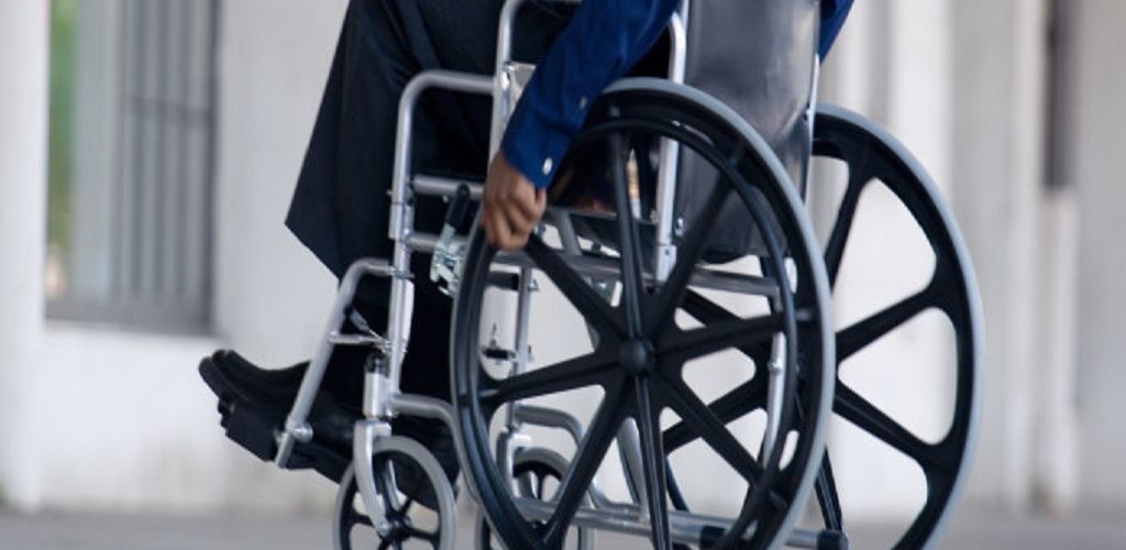 Side view of man in wheelchair